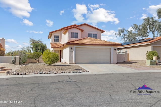 view of front facade with fence, driveway, stucco siding, a garage, and a tile roof