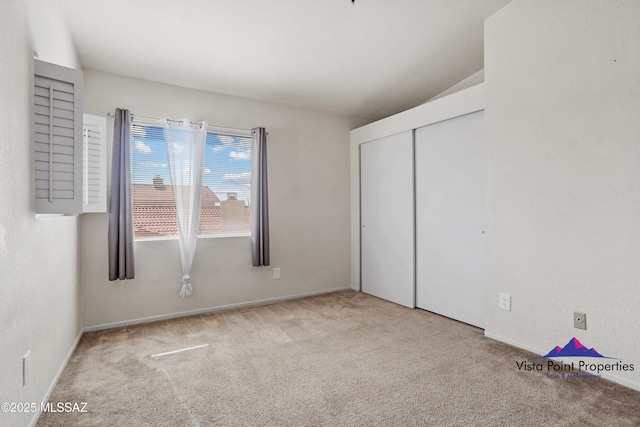 unfurnished bedroom featuring a closet and carpet