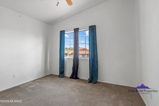 unfurnished room with vaulted ceiling, carpet flooring, and a ceiling fan