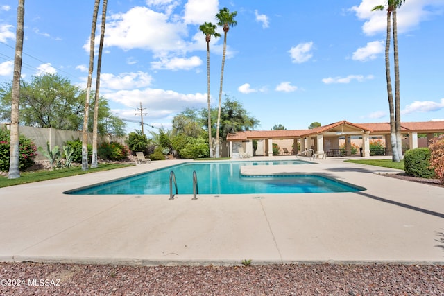 view of pool featuring a fenced in pool, fence, and a patio area