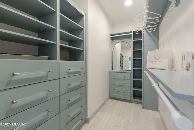 5391 W El Camino Del Cerro, Tucson, AZ 85745 - walk in closet featuring light wood-type flooring and a chandelier
