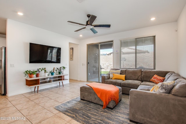 living room with light tile patterned flooring, recessed lighting, baseboards, and ceiling fan