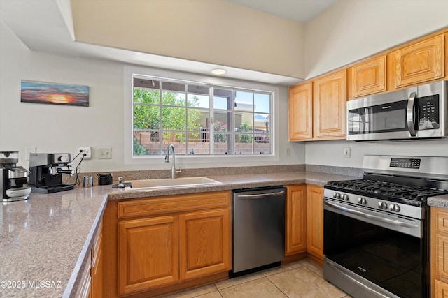 715 W Annandale Way, Tucson, AZ 85737 - kitchen with stainless steel appliances, a sink, and light tile patterned floors