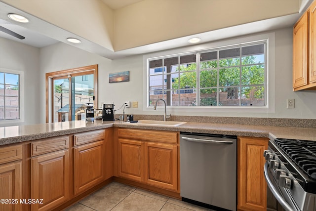715 W Annandale Way, Tucson, AZ 85737 - kitchen with appliances with stainless steel finishes, a sink, light tile patterned floors, recessed lighting, and brown cabinetry