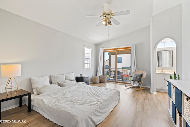 715 W Annandale Way, Tucson, AZ 85737 - bedroom featuring access to outside, lofted ceiling, light wood-style flooring, baseboards, and ensuite bath