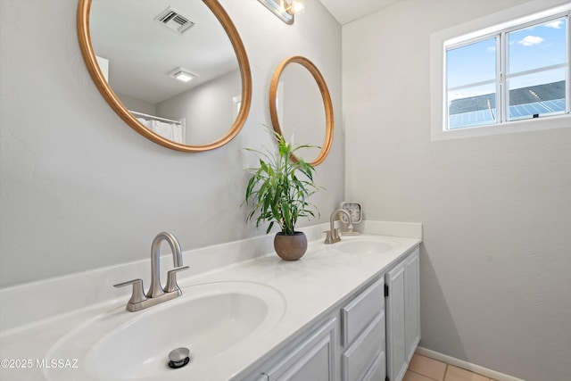 715 W Annandale Way, Tucson, AZ 85737 - full bathroom with double vanity and tile patterned floors