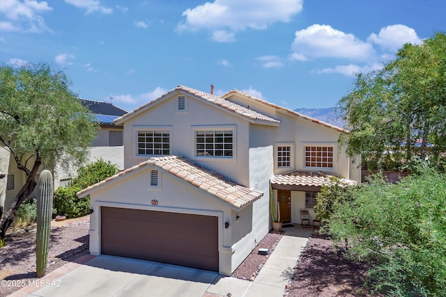 715 W Annandale Way, Tucson, AZ 85737 - mediterranean / spanish house featuring stucco siding, a tiled roof, driveway, and a garage