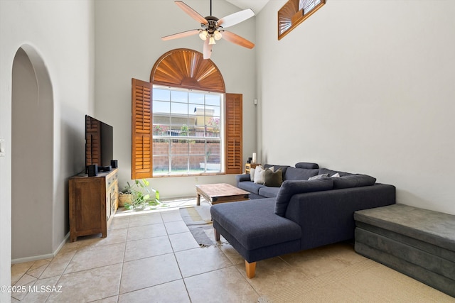 715 W Annandale Way, Tucson, AZ 85737 - living area featuring a towering ceiling, ceiling fan, arched walkways, and light tile patterned floors