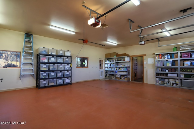 8060 E Diamondback Rd, Saint David, AZ 85630 - garage featuring a garage door opener and baseboards