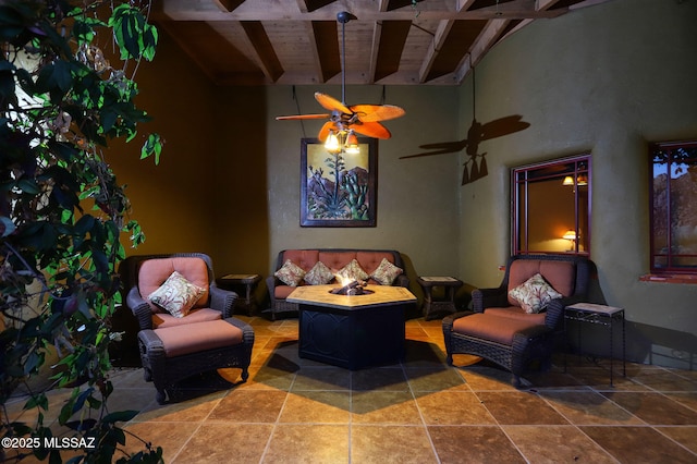 8060 E Diamondback Rd, Saint David, AZ 85630 - living area featuring wood ceiling, beamed ceiling, and ceiling fan