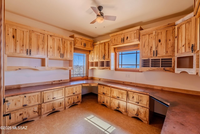 8060 E Diamondback Rd, Saint David, AZ 85630 - kitchen featuring light brown cabinets, built in study area, ceiling fan, and open shelves