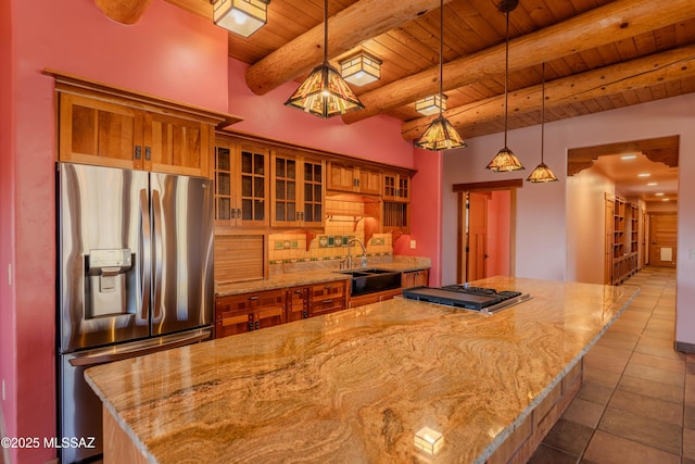 8060 E Diamondback Rd, Saint David, AZ 85630 - kitchen with wooden ceiling, a center island, dark tile patterned flooring, appliances with stainless steel finishes, and brown cabinetry