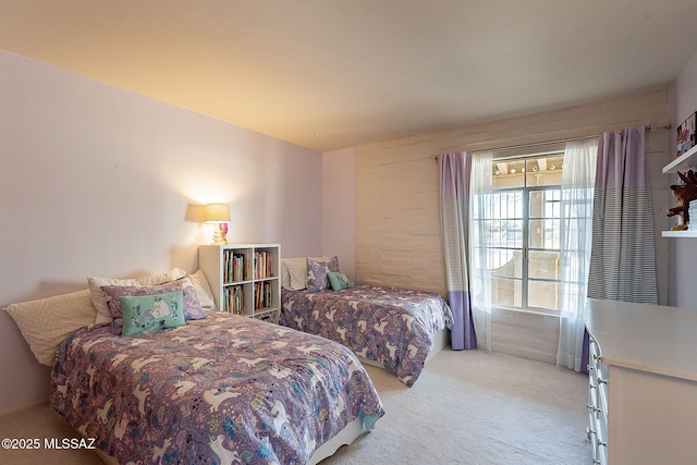 bedroom featuring light colored carpet