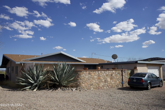 view of property exterior featuring a garage