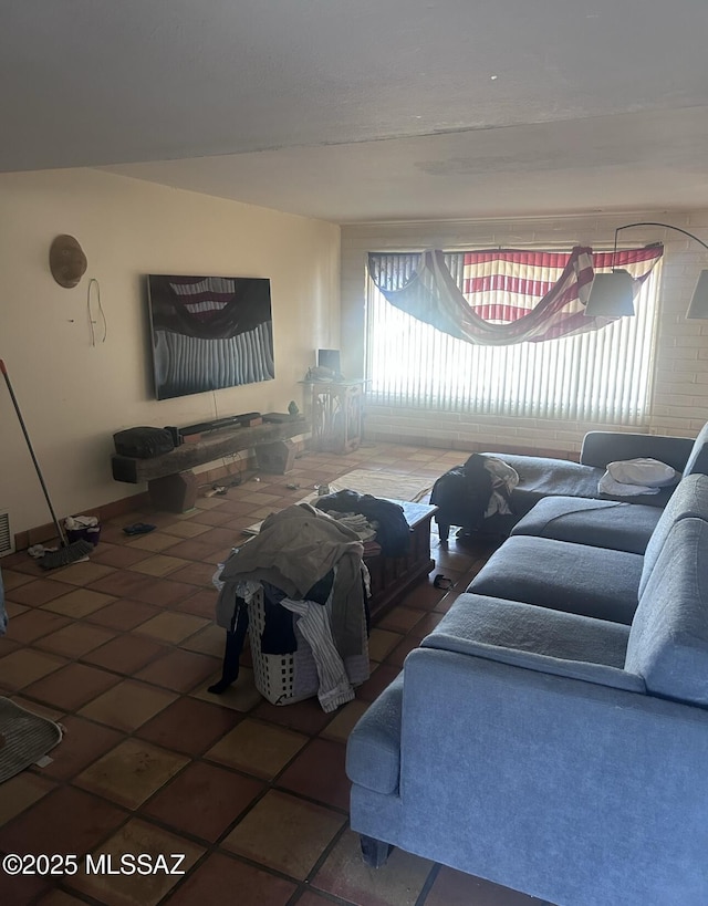 tiled living room featuring visible vents