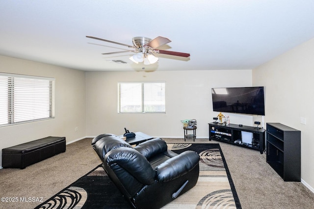 living room with visible vents, baseboards, ceiling fan, and carpet floors