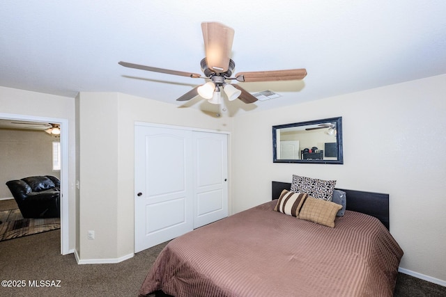 bedroom with a closet, visible vents, baseboards, and carpet floors