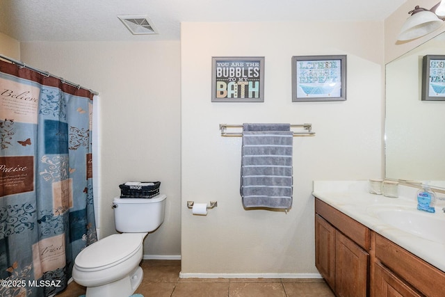 bathroom with tile patterned floors, visible vents, baseboards, and vanity