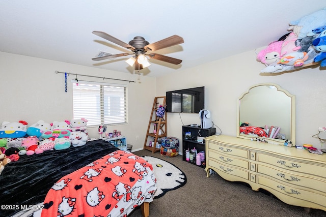 carpeted bedroom featuring visible vents and a ceiling fan