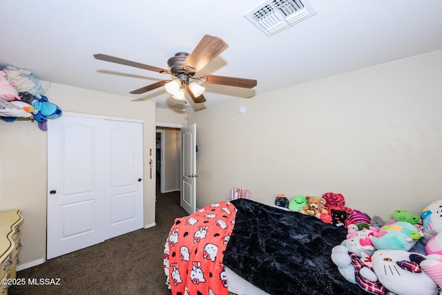 bedroom featuring visible vents, dark carpet, and ceiling fan