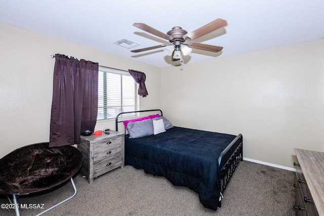 bedroom featuring carpet flooring, baseboards, visible vents, and ceiling fan