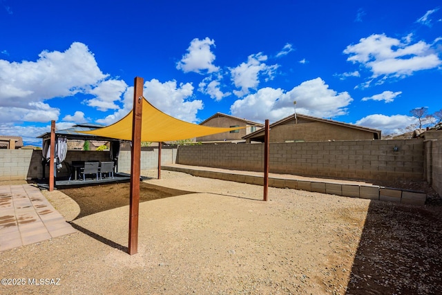 view of yard featuring a gazebo, a patio, and a fenced backyard