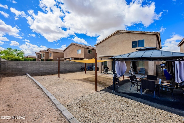 view of yard featuring a gazebo, a patio area, and a fenced backyard