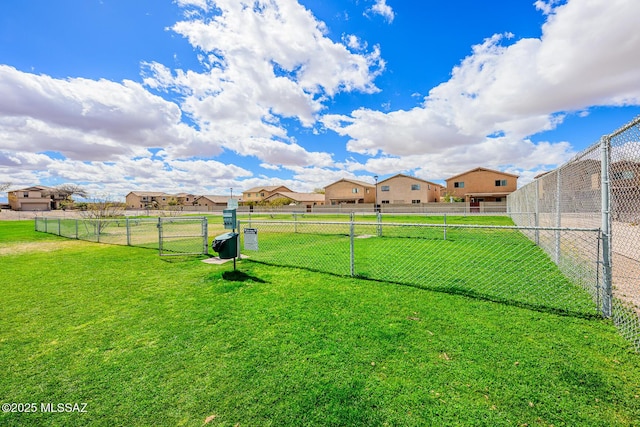 view of yard featuring a residential view and fence