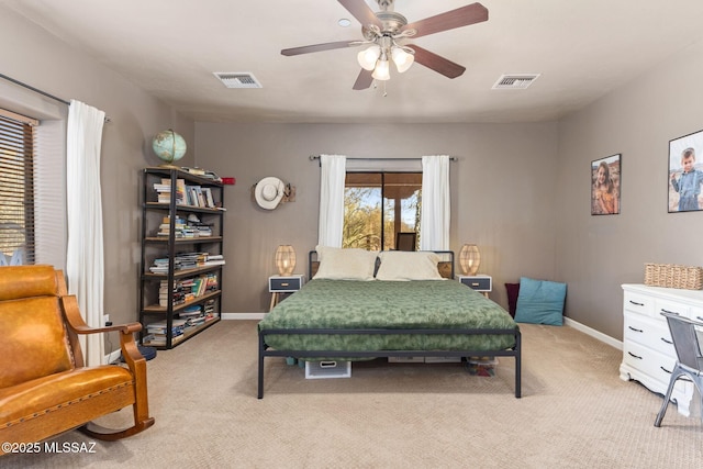 bedroom with visible vents, baseboards, and light colored carpet