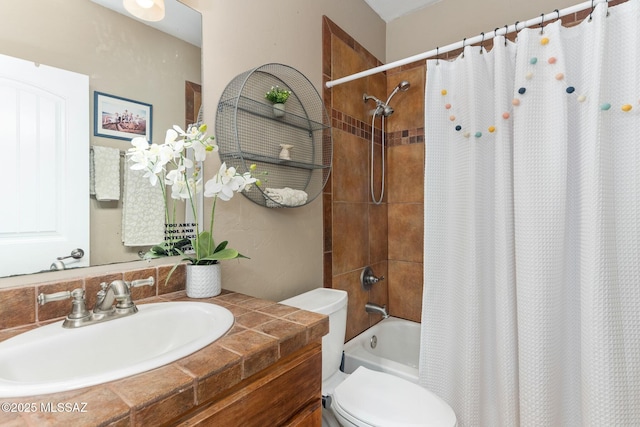 bathroom with vanity, toilet, and shower / bath combo