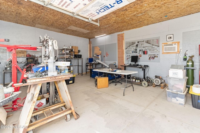 garage featuring a wall unit AC