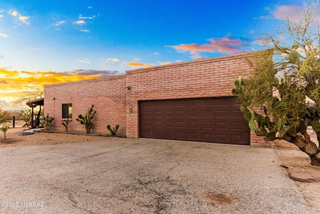 view of front of home with an attached garage and driveway