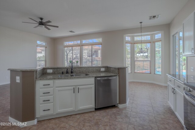 gym with baseboards, a paneled ceiling, wood finished floors, and ceiling fan