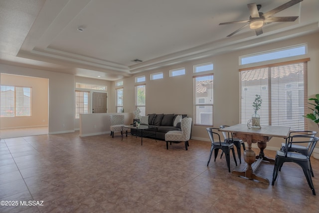 living room featuring ceiling fan with notable chandelier, baseboards, visible vents, and recessed lighting