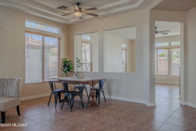 unfurnished dining area featuring a healthy amount of sunlight, a chandelier, visible vents, and tile patterned floors