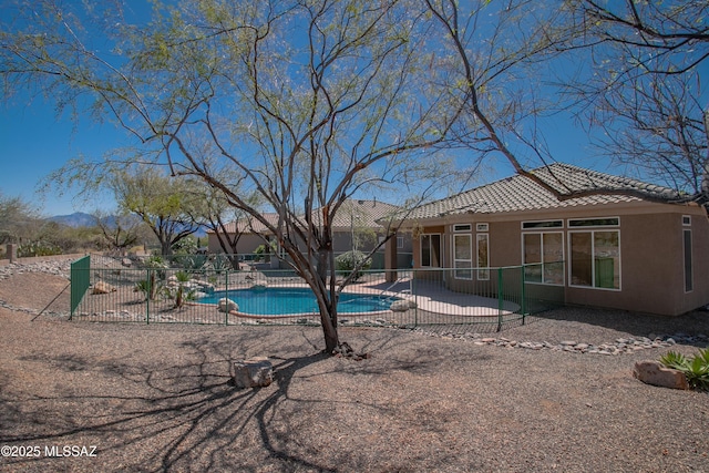 view of swimming pool featuring a fenced backyard, a patio, and a fenced in pool