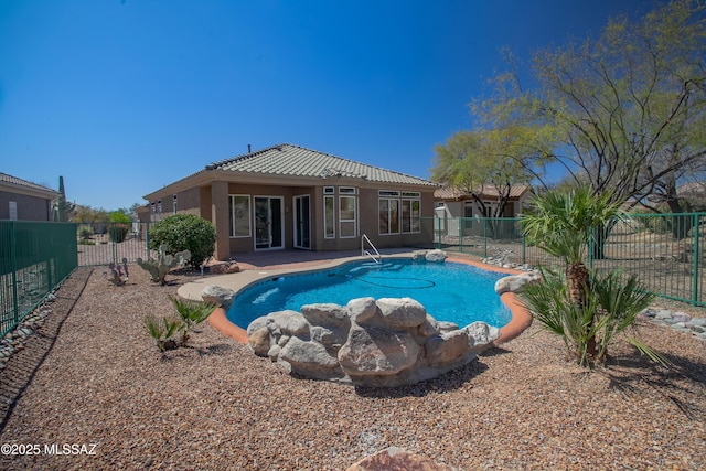 view of swimming pool with a patio area, a fenced backyard, and a fenced in pool