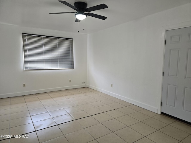 empty room with baseboards and ceiling fan