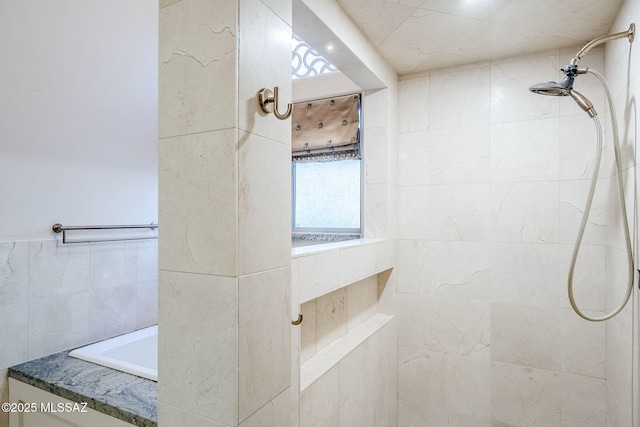 full bathroom with tiled shower