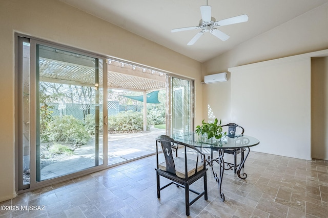 dining room with a wall mounted AC, lofted ceiling, a ceiling fan, and stone finish flooring