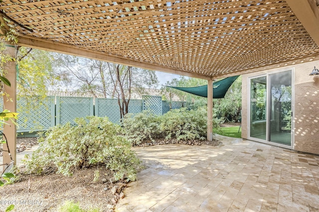 view of patio / terrace featuring a pergola and fence