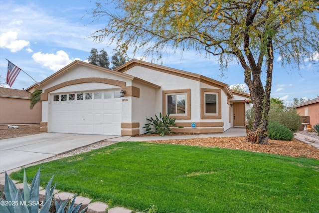 view of front of house with a front lawn, an attached garage, driveway, and stucco siding