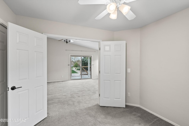 carpeted empty room with baseboards and ceiling fan