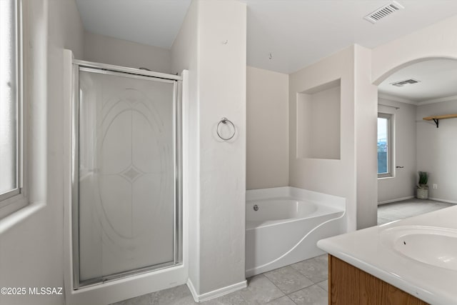 full bath with tile patterned floors, visible vents, a garden tub, and a shower stall