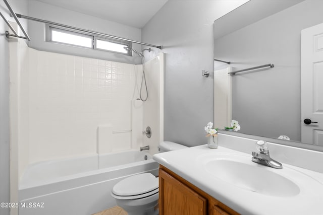 bathroom featuring vanity, toilet, and shower / bathtub combination