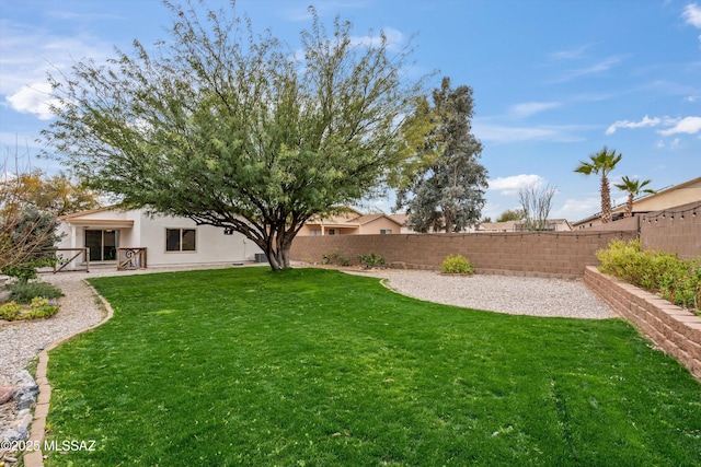 view of yard featuring a patio and a fenced backyard