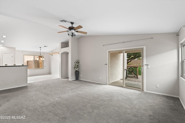 unfurnished living room featuring visible vents, lofted ceiling, carpet floors, recessed lighting, and ceiling fan with notable chandelier