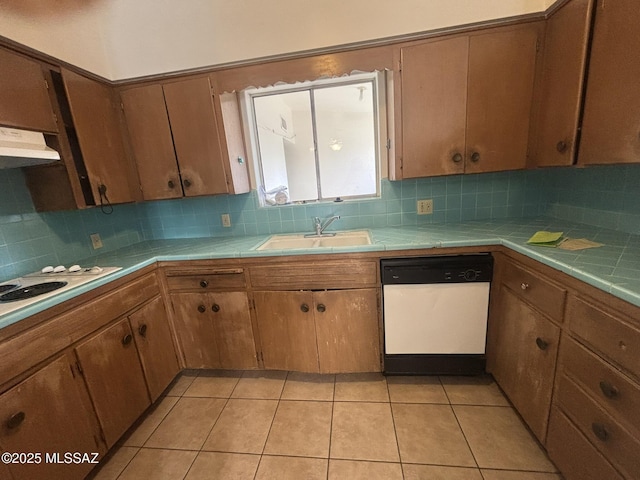 kitchen with tile countertops, white appliances, exhaust hood, and a sink