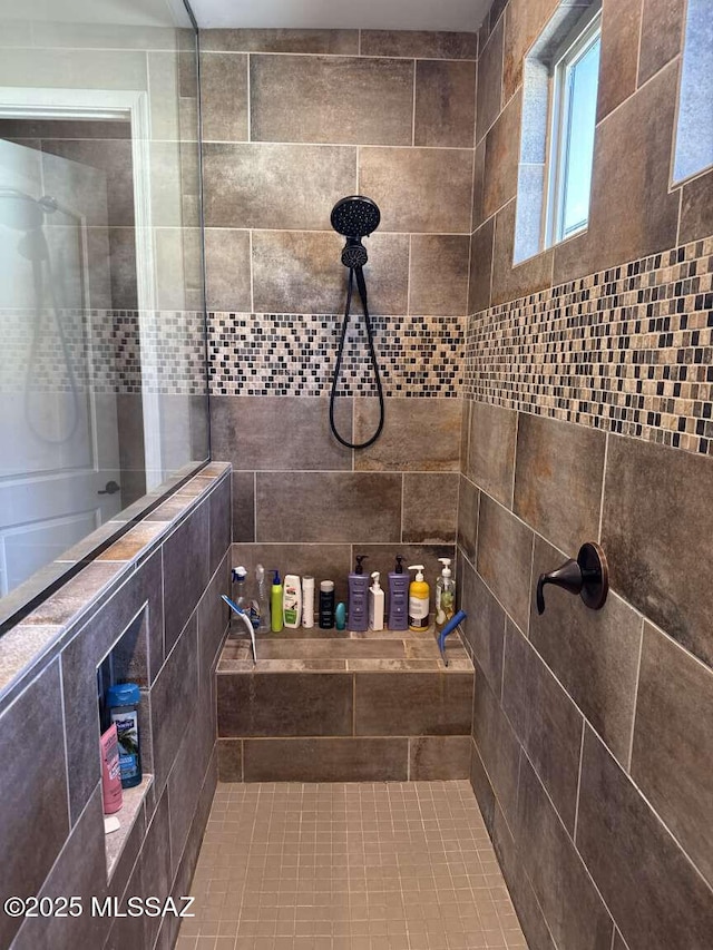 full bath with tiled shower