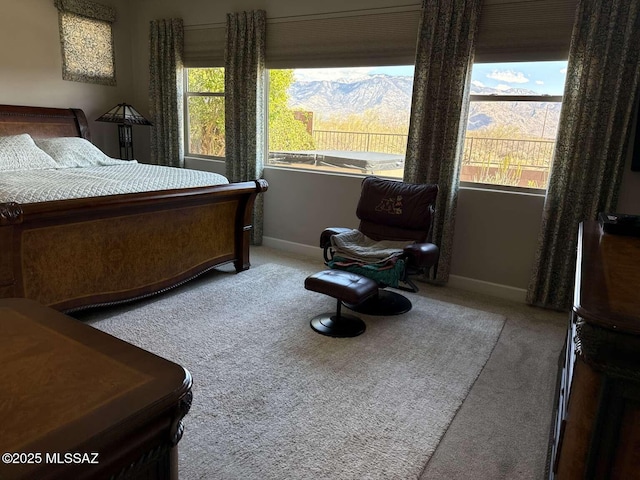 bedroom with carpet and baseboards